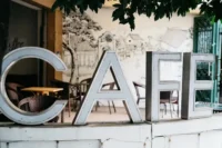 Fashion creatives discussing ideas together inside a calm café environment