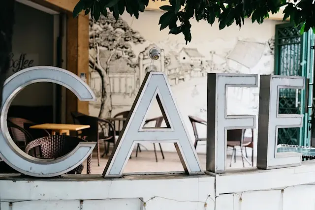 Fashion creatives discussing ideas together inside a calm café environment