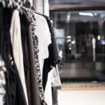 Modern fashion storefront with warm lighting and realistic retail atmosphere during evening hours