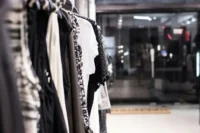 Modern fashion storefront with warm lighting and realistic retail atmosphere during evening hours
