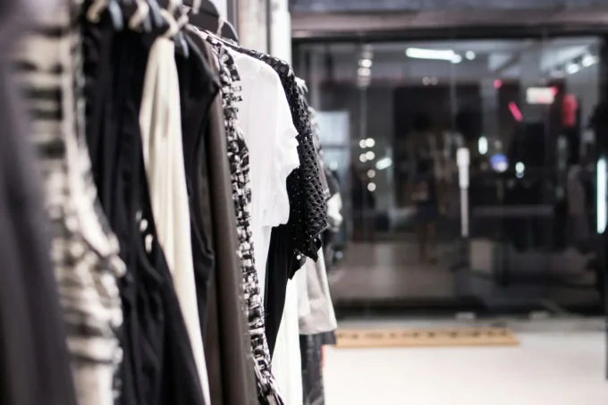 Modern fashion storefront with warm lighting and realistic retail atmosphere during evening hours