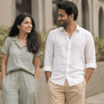 Indian man and woman in linen summer outfits sage green co-ord and white shirt beige chinos outdoor
